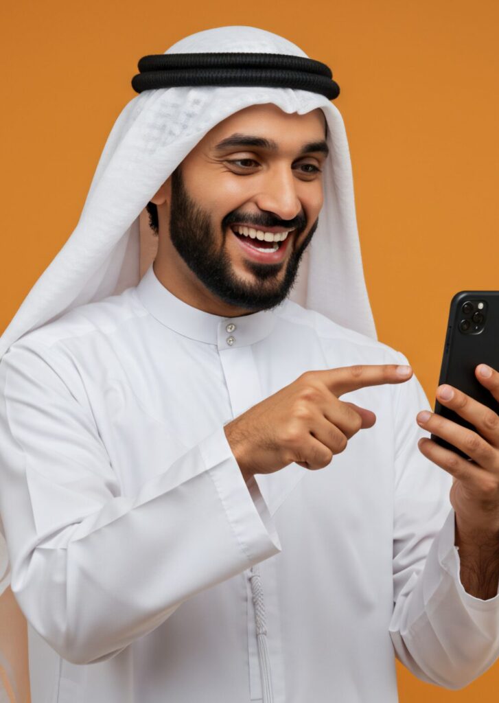 smiling arab man using smartphone on orange background